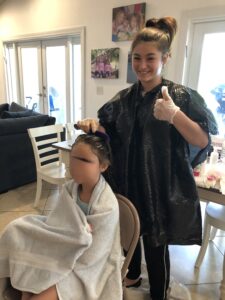 LouseCalls technician providing in-home head lice treatment for a child in Florida