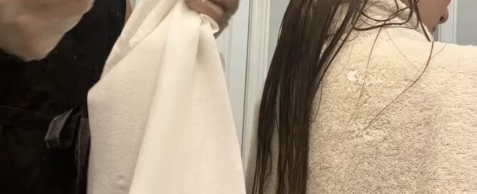 Louse Calls technician providing professional in-home head lice removal for a client